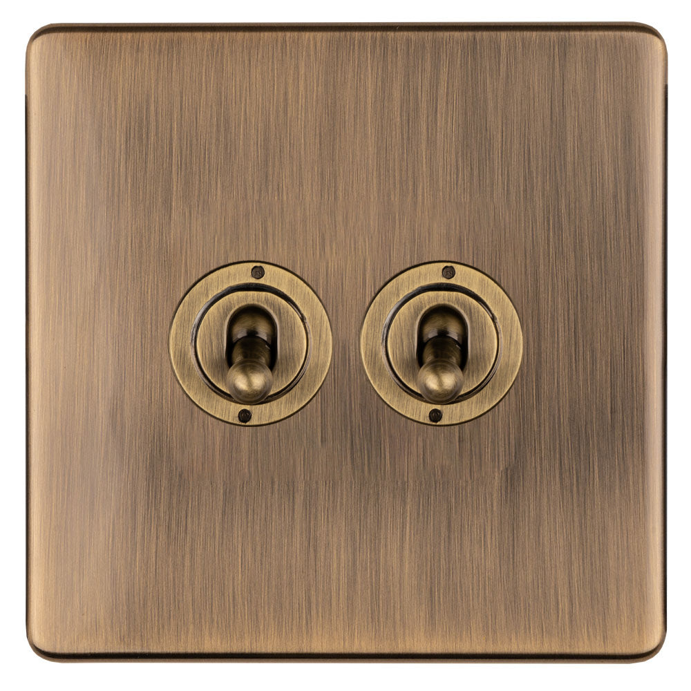 This is an image showing Eurolite 2 Gang 10Amp 2Way Toggle Switch - Antique Brassabt2sw available to order from T.H. Wiggans Ironmongery in Kendal, quick delivery and discounted prices.