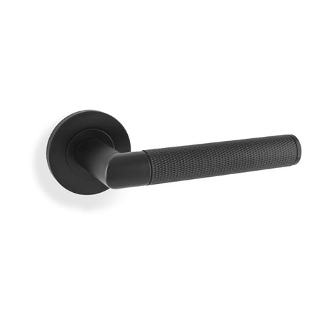 This is an image showing Alexander & Wilks Harrier Knurled Lever on Round Rose - Black aw210bl available to order from T.H Wiggans Ironmongery in Kendal, quick delivery and discounted prices.