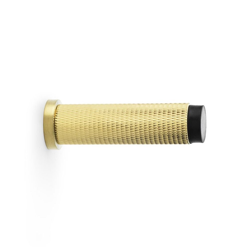 This is an image showing Alexander & Wilks Brunel Knurled Door Stop - Satin Brass PVD aw600-75-sbpvd available to order from T.H Wiggans Ironmongery in Kendal, quick delivery and discounted prices.