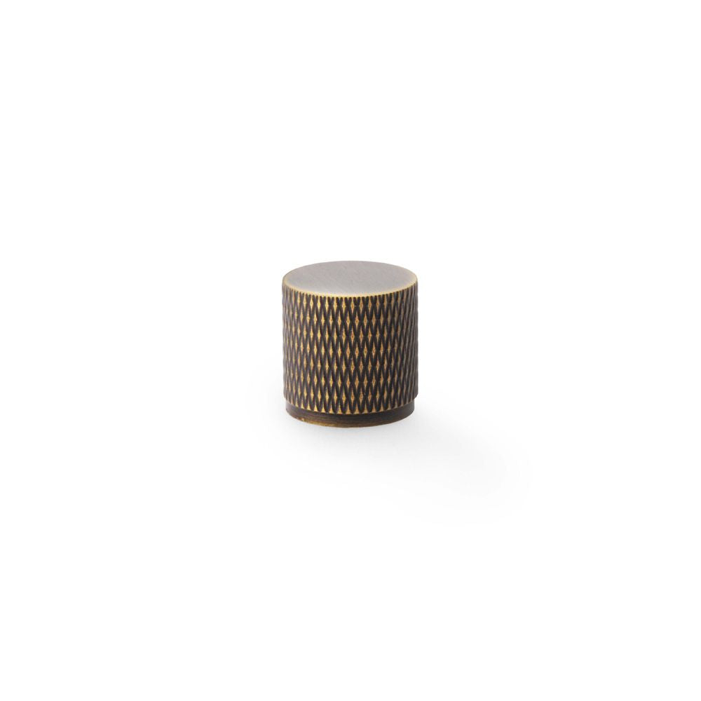 This is an image showing Alexander & Wilks Brunel Knurled Cylinder Cupboard Knob - Antique Brass - 20mm aw800-20-ab available to order from T.H Wiggans Ironmongery in Kendal, quick delivery and discounted prices.