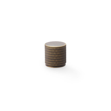 This is an image showing Alexander & Wilks Brunel Knurled Cylinder Cupboard Knob - Antique Brass - 20mm aw800-20-ab available to order from T.H Wiggans Ironmongery in Kendal, quick delivery and discounted prices.