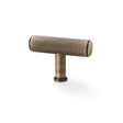 This is an image showing Alexander & Wilks Crispin Knurled T-bar Cupboard Knob - Antique Brass aw801-55-ab available to order from T.H Wiggans Ironmongery in Kendal, quick delivery and discounted prices.