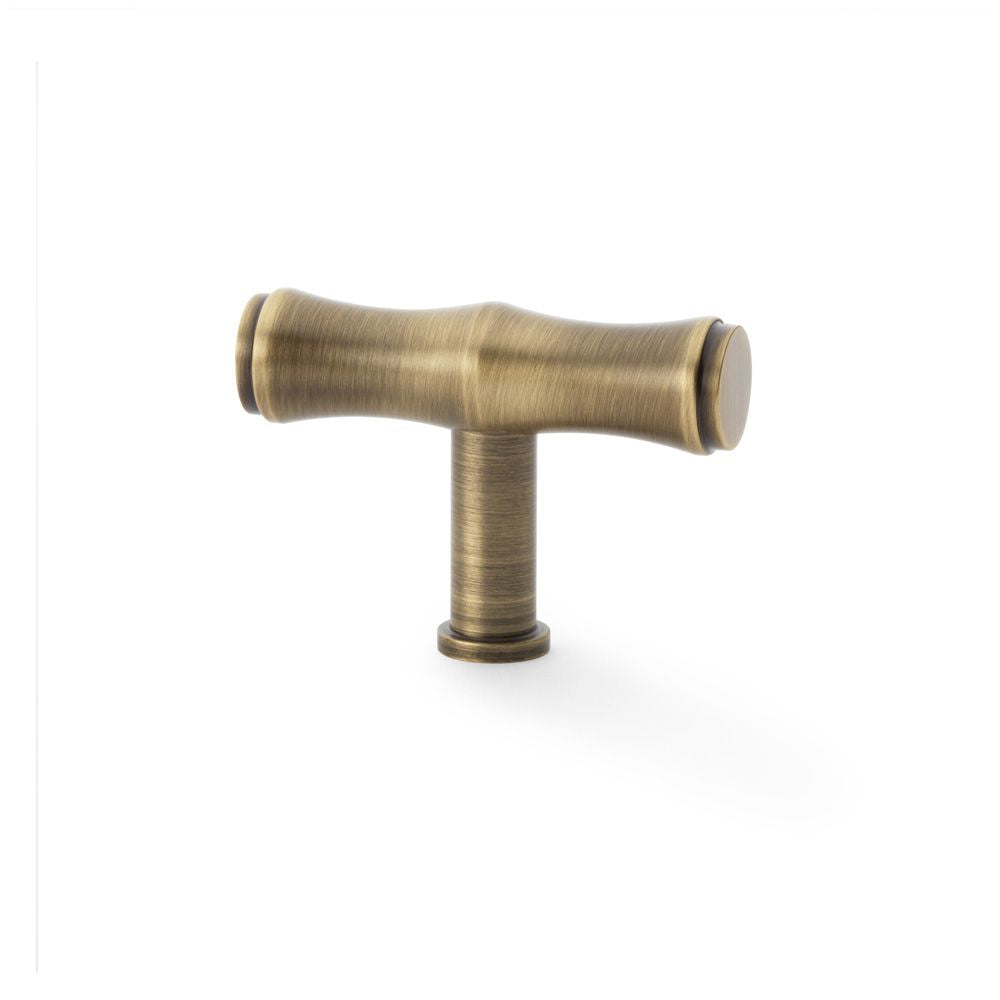 This is an image showing Alexander & Wilks Crispin Bamboo T-bar Cupboard Knob - Antique Brass aw801b-55-ab available to order from T.H Wiggans Ironmongery in Kendal, quick delivery and discounted prices.