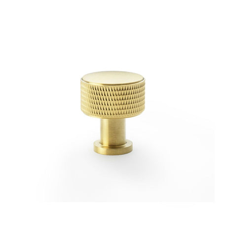 This is an image showing Alexander & Wilks Lucia Knurled Cupboard Knob - Satin Brass PVD - 29mm aw807k-29-sbpvd available to order from T.H Wiggans Ironmongery in Kendal, quick delivery and discounted prices.