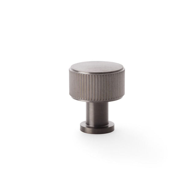 This is an image showing Alexander & Wilks Lucia Reeded Cupboard Knob - Dark Bronze PVD - 29mm aw807r-29-dbzpvd available to order from T.H Wiggans Ironmongery in Kendal, quick delivery and discounted prices.