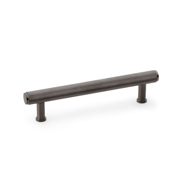 This is an image showing Alexander & Wilks Crispin Knurled T-bar Cupboard Pull Handle - Dark Bronze PVD - Centres 128mm aw809-128-dbzpvd available to order from T.H Wiggans Ironmongery in Kendal, quick delivery and discounted prices.