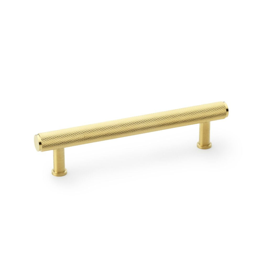 This is an image showing Alexander & Wilks Crispin Knurled T-bar Cupboard Pull Handle - Satin Brass PVD - Centres 128mm aw809-128-sbpvd available to order from T.H Wiggans Ironmongery in Kendal, quick delivery and discounted prices.