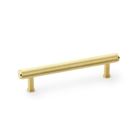 This is an image showing Alexander & Wilks Crispin Knurled T-bar Cupboard Pull Handle - Satin Brass PVD - Centres 128mm aw809-128-sbpvd available to order from T.H Wiggans Ironmongery in Kendal, quick delivery and discounted prices.