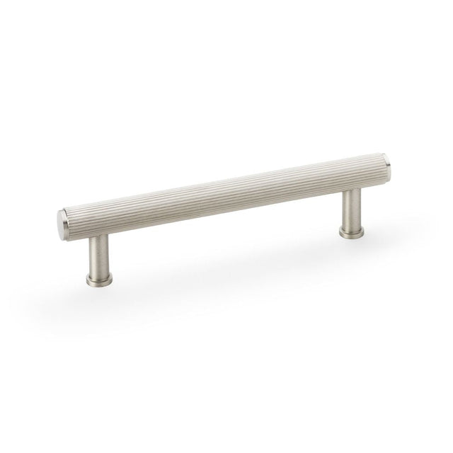 This is an image showing Alexander & Wilks Crispin Reeded T-bar Cupboard Pull Handle - Satin Nickel - 128mm aw809r-128-sn available to order from T.H Wiggans Ironmongery in Kendal, quick delivery and discounted prices.