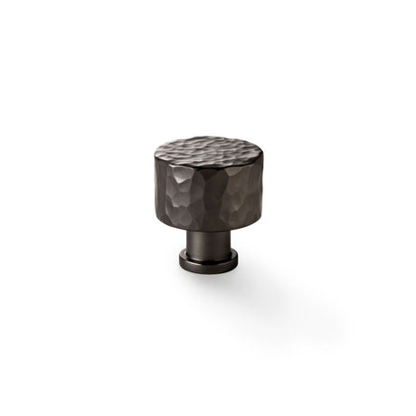 This is an image showing Alexander & Wilks Leila Hammered Cupboard Knob - Dark Bronze - 30mm aw816-30-dbz available to order from T.H Wiggans Ironmongery in Kendal, quick delivery and discounted prices.