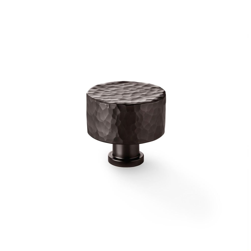 This is an image showing Alexander & Wilks Leila Hammered Cupboard Knob - Dark Bronze - 35mm aw816-35-dbz available to order from T.H Wiggans Ironmongery in Kendal, quick delivery and discounted prices.