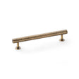 This is an image showing Alexander & Wilks Leila Hammered Cabinet Pull - Antique Brass aw817-160-ab available to order from T.H Wiggans Ironmongery in Kendal, quick delivery and discounted prices.