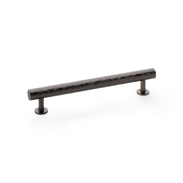 This is an image showing Alexander & Wilks Leila Hammered Cabinet Pull - Dark Bronze aw817-160-dbz available to order from T.H Wiggans Ironmongery in Kendal, quick delivery and discounted prices.