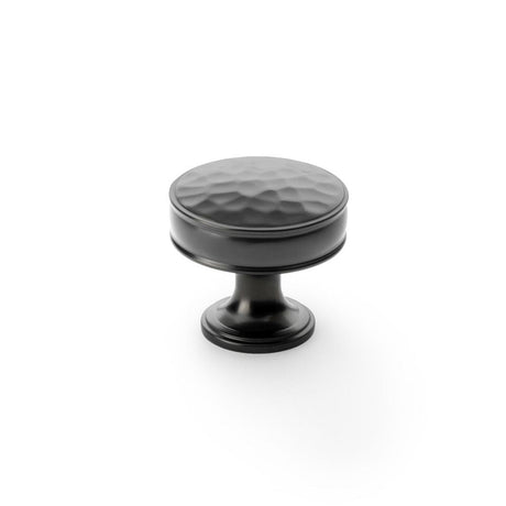 This is an image showing Alexander & Wilks Lynd Hammered Cupboard Knob - Dark Bronze - 38mm aw818-38-dbz available to order from T.H Wiggans Ironmongery in Kendal, quick delivery and discounted prices.