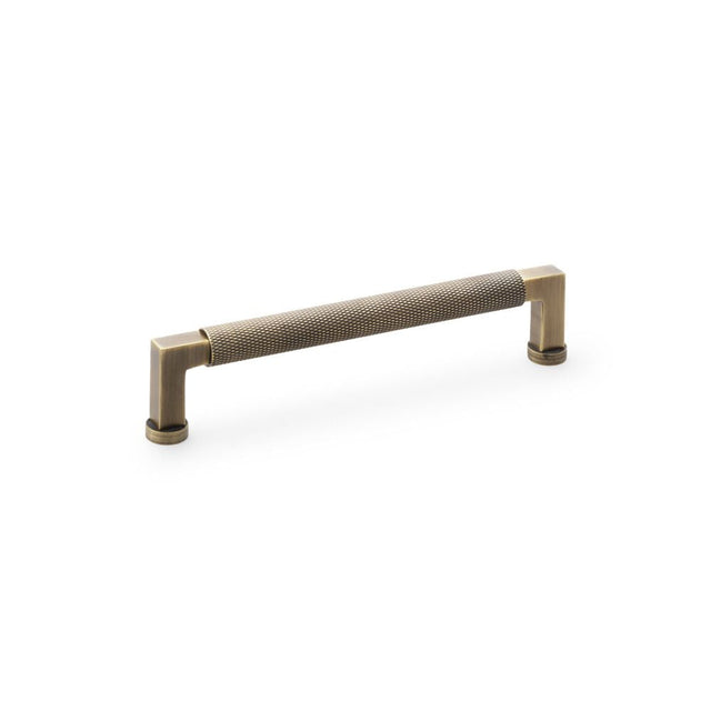 This is an image showing Alexander & Wilks Camille Knurled Cabinet Pull Handle - Antique Brass aw819-160-ab available to order from T.H Wiggans Ironmongery in Kendal, quick delivery and discounted prices.