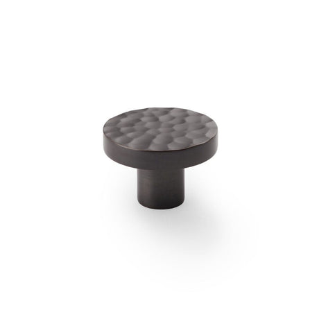 This is an image showing Alexander & Wilks Hanover Hammered Cupboard Knob - Dark Bronze - 38mm aw820-38-dbz available to order from T.H Wiggans Ironmongery in Kendal, quick delivery and discounted prices.