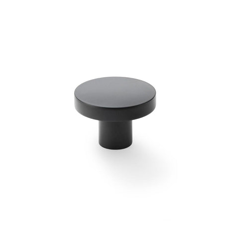 This is an image showing Alexander & Wilks Hanover Plain Cupboard Knob - Black - Knob 38mm aw821-38-bl available to order from T.H Wiggans Ironmongery in Kendal, quick delivery and discounted prices.