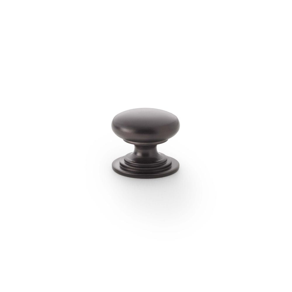 This is an image showing Alexander & Wilks Waltz Round Cupboard Knob on Stepped Rose - Dark Bronze - 25mm aw825-25-dbz available to order from T.H Wiggans Ironmongery in Kendal, quick delivery and discounted prices.