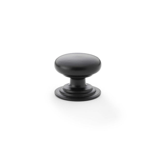 This is an image showing Alexander & Wilks Waltz Round Cupboard Knob on Stepped Rose - Black - 32mm aw825-32-bl available to order from T.H Wiggans Ironmongery in Kendal, quick delivery and discounted prices.