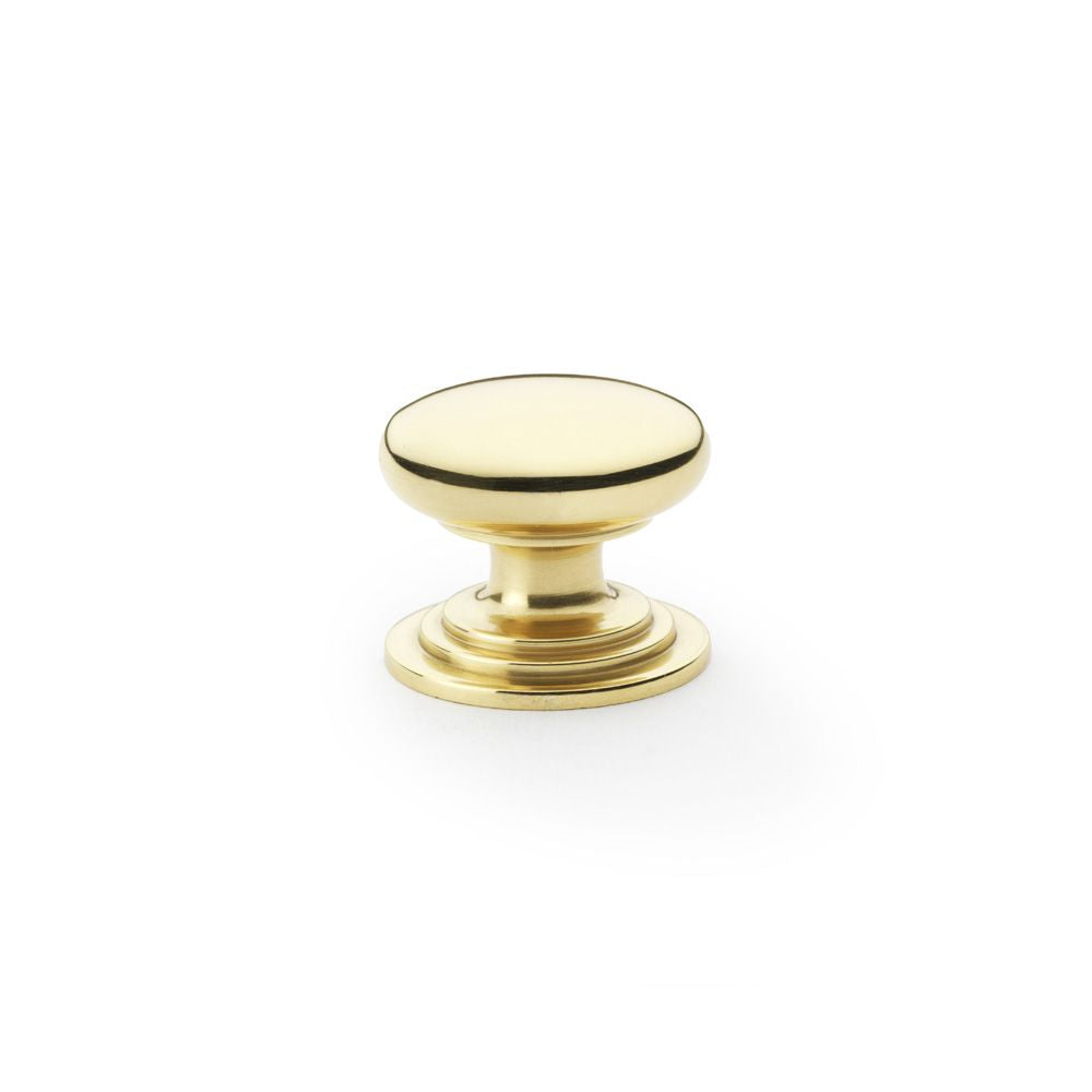 This is an image showing Alexander & Wilks Waltz Round Cupboard Knob on Stepped Rose - Polished Brass - 32mm aw825-32-pbl available to order from T.H Wiggans Ironmongery in Kendal, quick delivery and discounted prices.