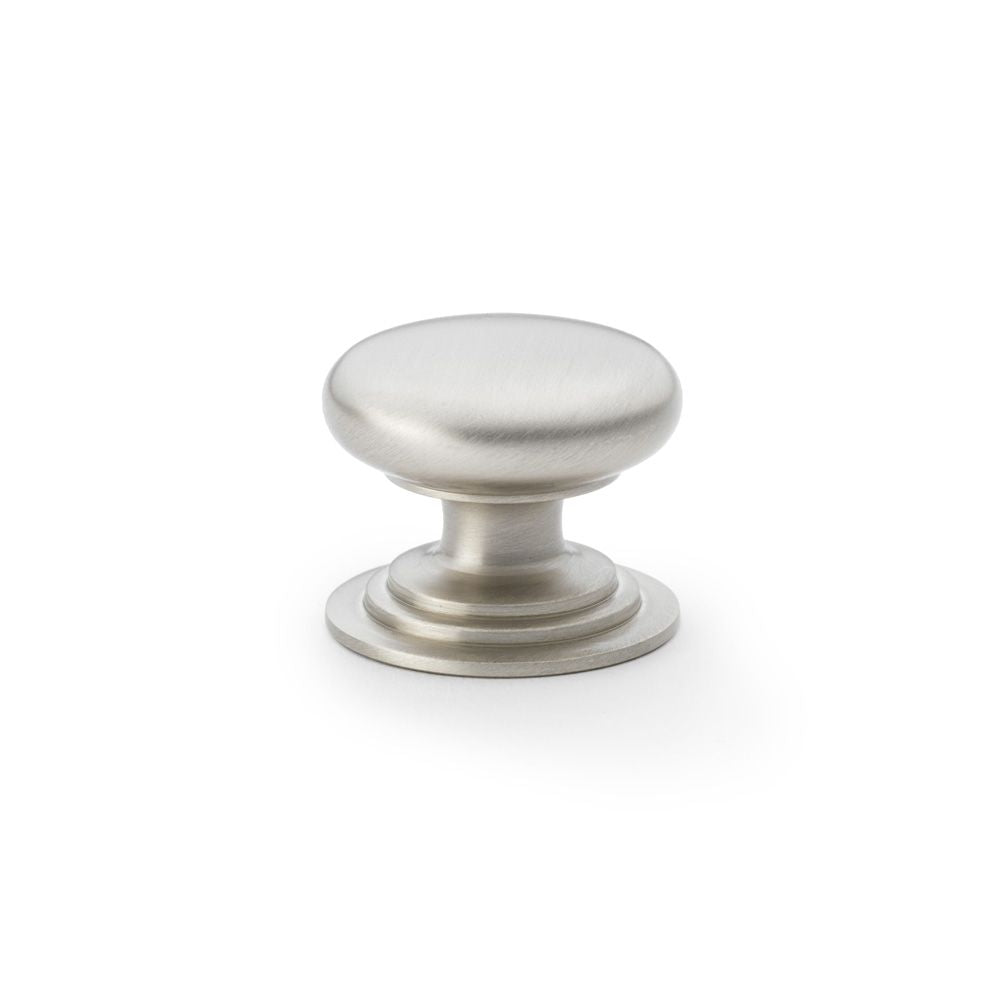 This is an image showing Alexander & Wilks Waltz Round Cupboard Knob on Stepped Rose - Satin Nickel - 38mm aw825-38-sn available to order from T.H Wiggans Ironmongery in Kendal, quick delivery and discounted prices.