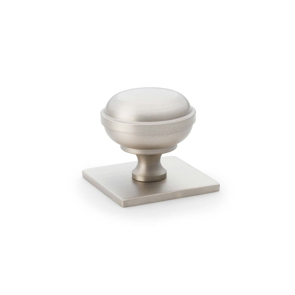 This is an image showing Alexander & Wilks Quantock Cupboard Knob on Square Backplate - Satin Nickel - 34mm aw826-34-sn available to order from T.H Wiggans Ironmongery in Kendal, quick delivery and discounted prices.