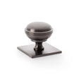 This is an image showing Alexander & Wilks Quantock Cupboard Knob on Square Backplate - Dark Bronze PVD - 38mm aw826-38-dbzpvd available to order from T.H Wiggans Ironmongery in Kendal, quick delivery and discounted prices.