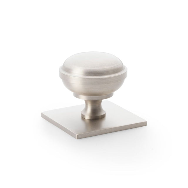 This is an image showing Alexander & Wilks Quantock Cupboard Knob on Square Backplate - Satin Nickel - 38mm aw826-38-sn available to order from T.H Wiggans Ironmongery in Kendal, quick delivery and discounted prices.