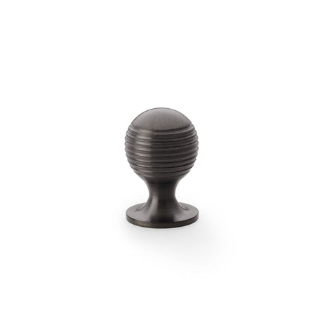 This is an image showing Alexander & Wilks Caesar Cupboard Knob on Round Rose - Dark Bronze PVD - 25mm aw832-25-dbzpvd available to order from T.H Wiggans Ironmongery in Kendal, quick delivery and discounted prices.