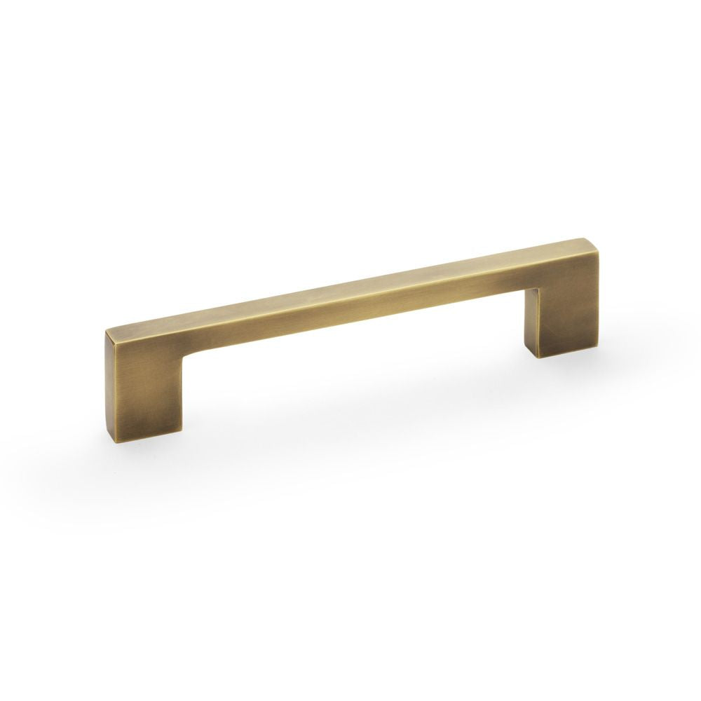 This is an image showing Alexander & Wilks Marco Cupboard Pull Handle - Antique Brass - 128mm aw837-128-ab available to order from T.H Wiggans Ironmongery in Kendal, quick delivery and discounted prices.