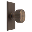 This is an image of a Carlisle Brass - Lines Radio Knob on Backplate that is availble to order from T.H Wiggans Architectural Ironmongery in Kendal in Kendal.