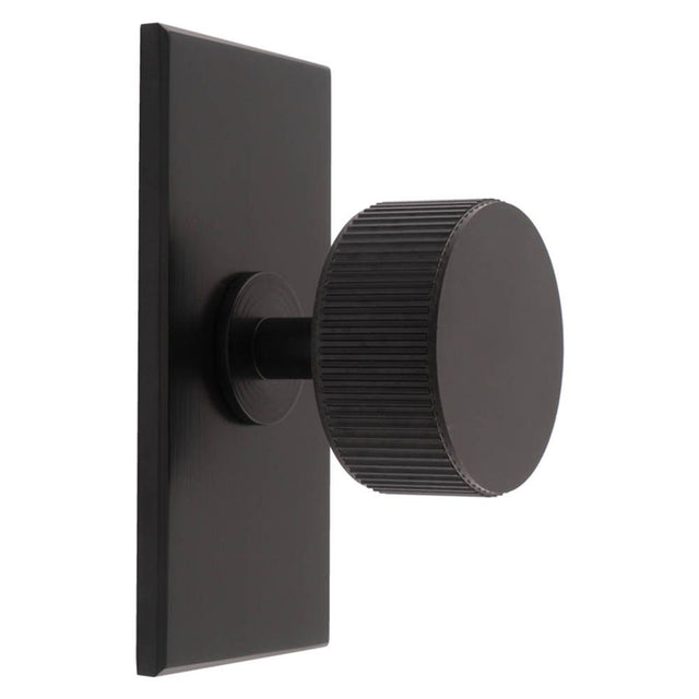 This is an image of a Carlisle Brass - Lines Radio Knob on Backplate that is availble to order from T.H Wiggans Architectural Ironmongery in Kendal in Kendal.