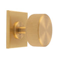 This is an image of a Carlisle Brass - Lines Radio Knob on Backplate that is availble to order from T.H Wiggans Architectural Ironmongery in Kendal in Kendal.