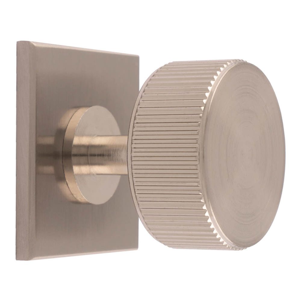 This is an image of a Carlisle Brass - Lines Radio Knob on Backplate that is availble to order from T.H Wiggans Architectural Ironmongery in Kendal in Kendal.