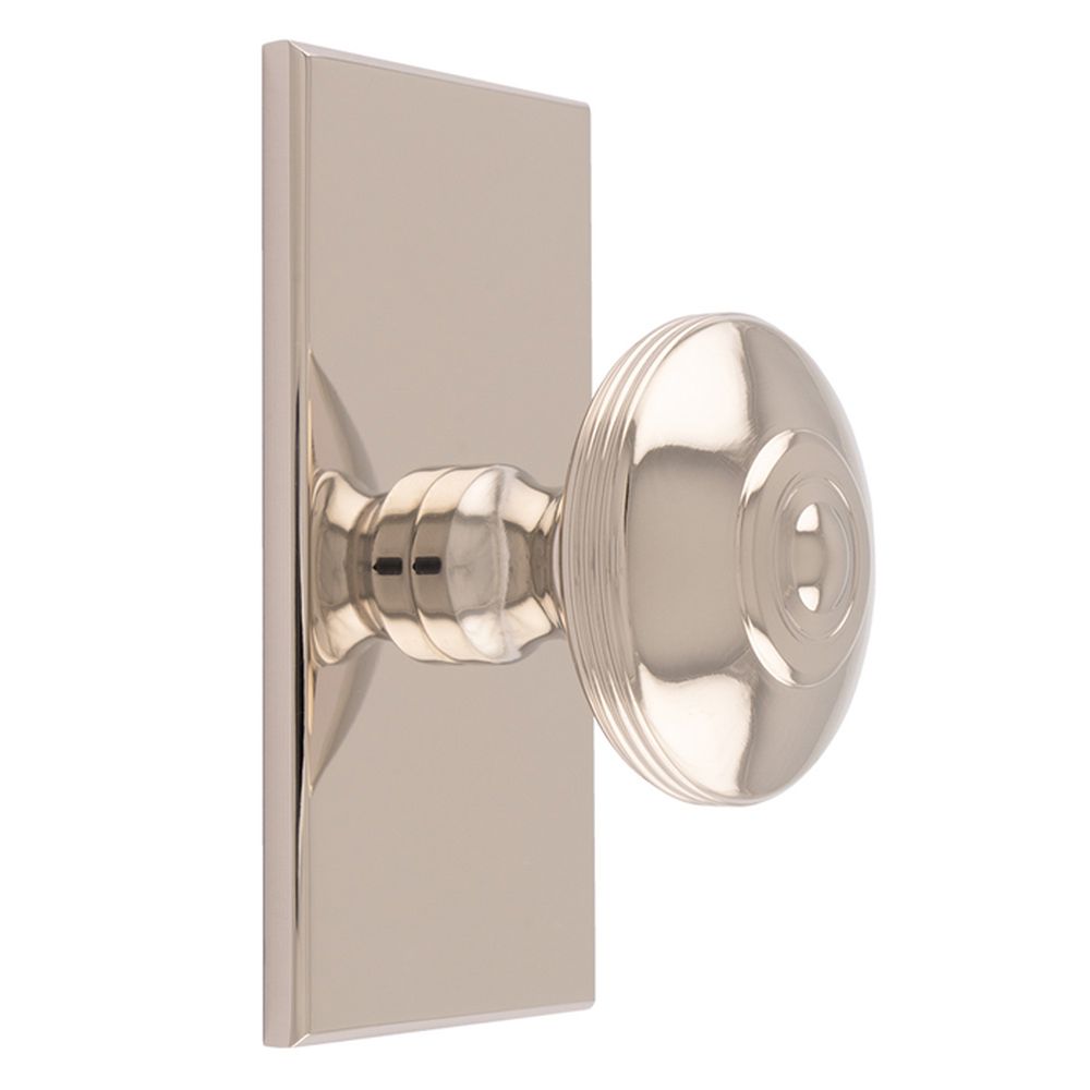 This is an image of a Carlisle Brass - Anderson knob on Backplate that is availble to order from T.H Wiggans Architectural Ironmongery in Kendal in Kendal.