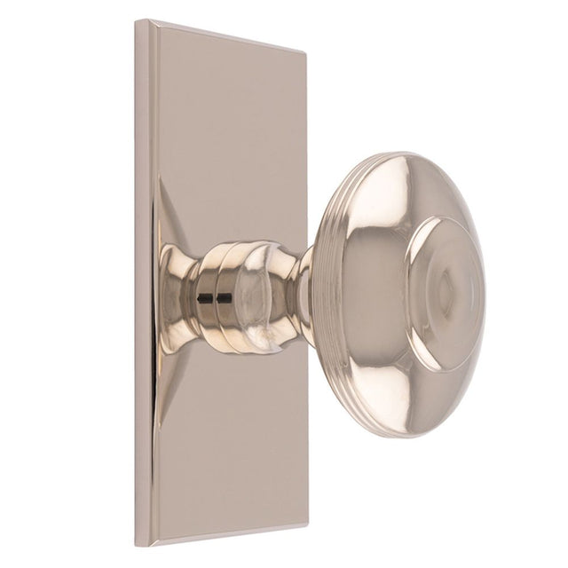 This is an image of a Carlisle Brass - Anderson knob on Backplate that is availble to order from T.H Wiggans Architectural Ironmongery in Kendal in Kendal.