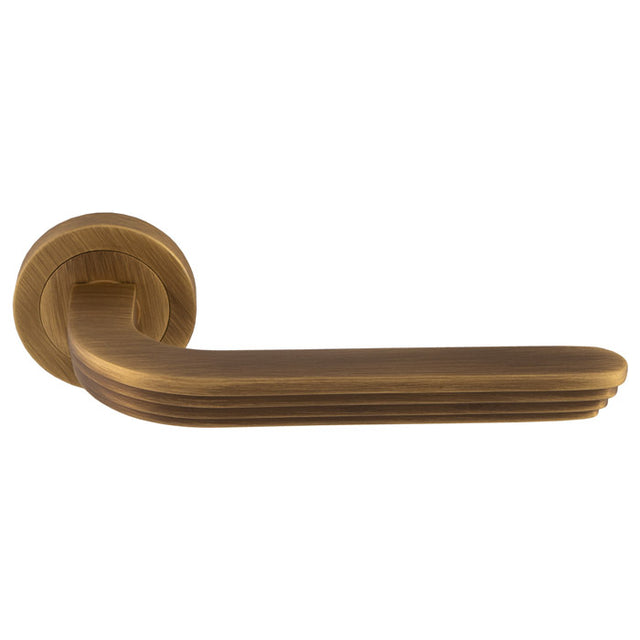 This is an image of a Manital - Cloud Lever on Rose - Antique Brass cd5ab that is availble to order from T.H Wiggans Ironmongery in Kendal.