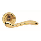 This is an image of Manital - Apollo Lever on Round Rose - Polished Brass available to order from T.H Wiggans Architectural Ironmongery in Kendal, quick delivery and discounted prices.