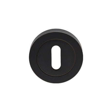 This is an image of Carlisle Brass - Lock Escutcheon - Matt Black available to order from T.H Wiggans Architectural Ironmongery in Kendal, quick delivery and discounted prices.