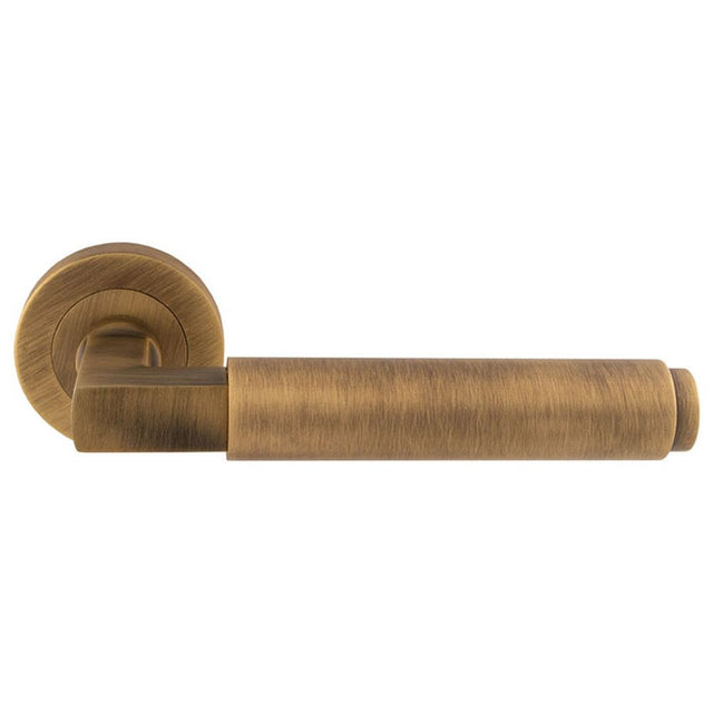 This is an image of Carlisle Brass - Masano Lever On Rose - Antique Brass available to order from T.H Wiggans Architectural Ironmongery in Kendal, quick delivery and discounted prices.