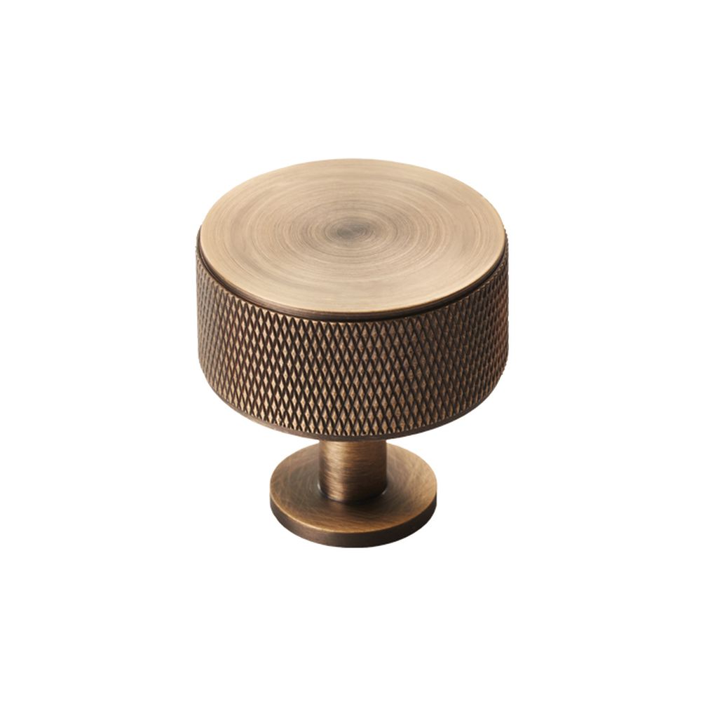 This is an image of a Carlisle Brass - Knurled Radio Knob - Antique Brass that is availble to order from T.H Wiggans Architectural Ironmongery in Kendal in Kendal.