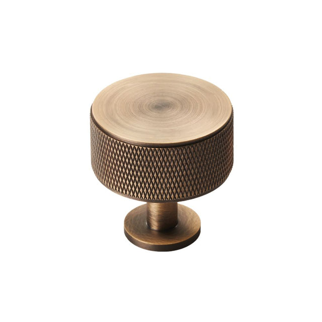 This is an image of a Carlisle Brass - Knurled Radio Knob - Antique Brass that is availble to order from T.H Wiggans Architectural Ironmongery in Kendal in Kendal.