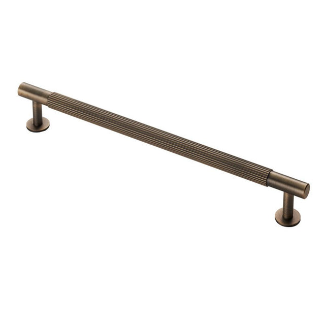 This is an image of a Carlisle Brass - Lines Pull Handle 224mm c/c - Antique Brass that is availble to order from T.H Wiggans Architectural Ironmongery in Kendal in Kendal.