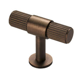 This is an image of a Carlisle Brass - Lines T-bar knob - Antique Brass that is availble to order from T.H Wiggans Architectural Ironmongery in Kendal in Kendal.