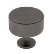 This is an image of a Carlisle Brass - Lines Radio Knob Anthracite that is availble to order from T.H Wiggans Architectural Ironmongery in Kendal in Kendal.