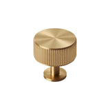 This is an image of a Carlisle Brass - Lines Radio Knob Satin Brass that is availble to order from T.H Wiggans Architectural Ironmongery in Kendal in Kendal.