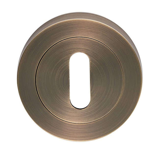 This is an image of Carlisle Brass - Standard profile Escutcheon - Antique Brass available to order from T.H Wiggans Architectural Ironmongery in Kendal, quick delivery and discounted prices.