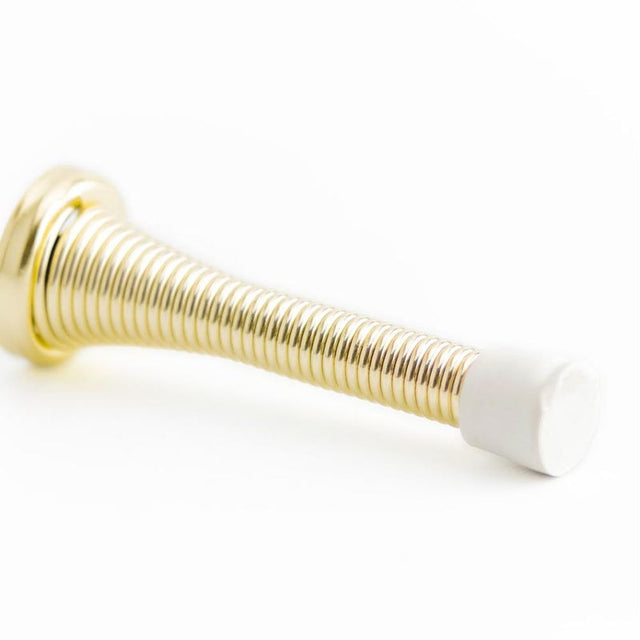 This is an image showing the Frelan - Wall Mounted Spring Door Stop - Electro Brass available to order from T.H. Wiggans Ironmongery in Kendal