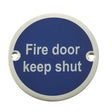 This is an image showing the Frelan - Fire Door Keep Shut' - Signage 75mm Dia. - Satin Anodised Aluminium available to order from T.H. Wiggans Ironmongery in Kendal