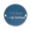 This is an image showing the Frelan - Fire Door Keep Locked' - Signage 75mm Dia. - Satin Stainless Steel available to order from T.H. Wiggans Ironmongery in Kendal